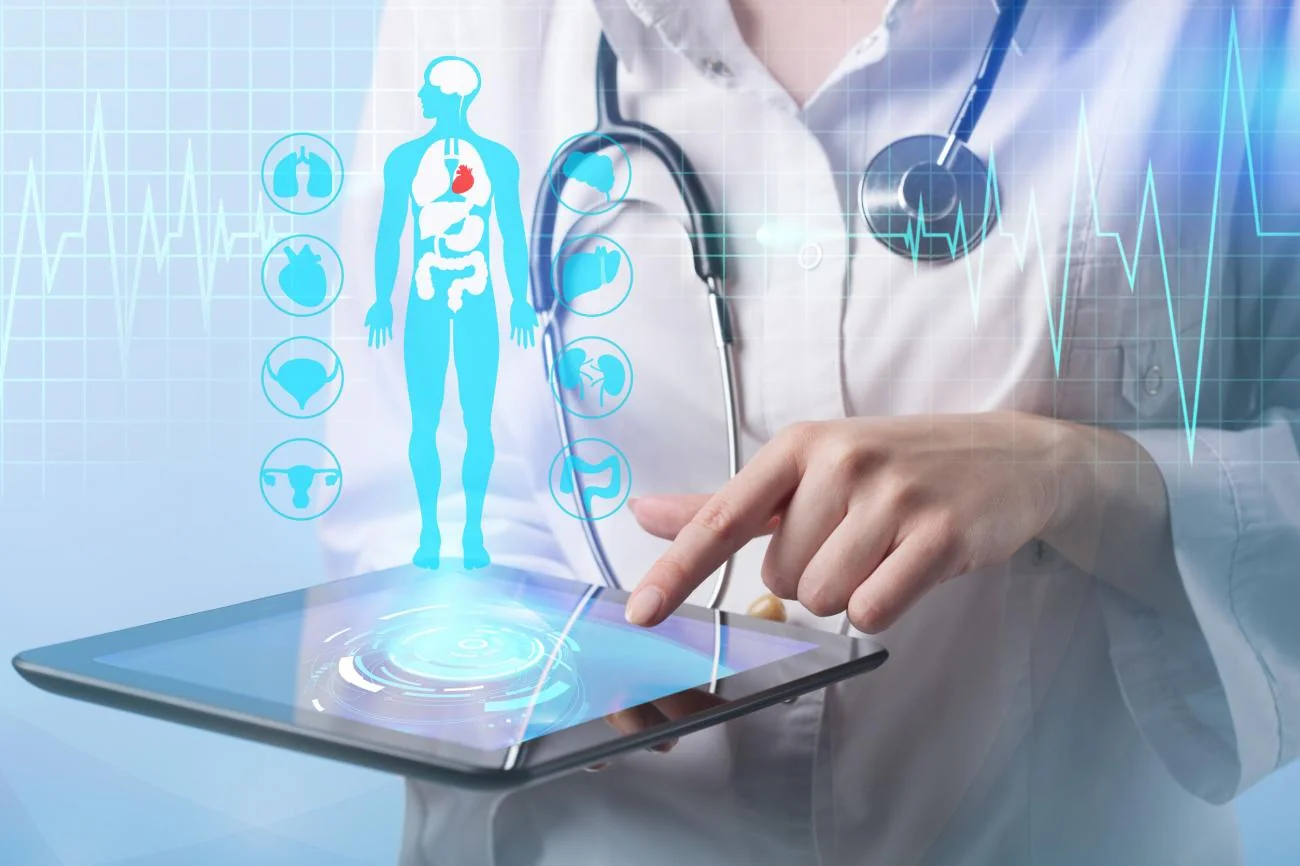 A clinician reviewing a digital anatomy display on a tablet