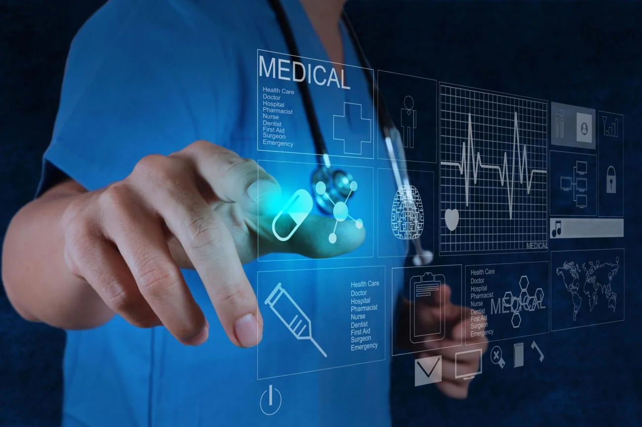 A medical professional interacting with a digital health information display